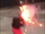 Moment a girl screams as a firework explodes in her hood