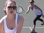Natalie Portman plays tennis in tank top and leggings