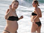 Tessa James shows off her growing belly during babymoon