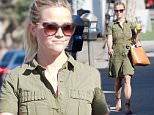 Reese Witherspoon flaunts stems in smart green shirt dress