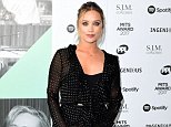 Laura Whitmore parades her legs in ruffled polka-dot gown