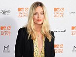 Braless Laura Whitmore flashes her cleavage in retro shirt