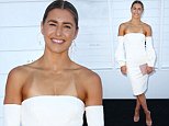 Frances Abbott shows off tan lines in a chic white frock
