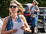 Georgie Gardner seen leaving lawyer's house with document
