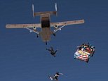 Skydivers drive a car out of a plane in Arizona