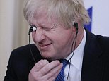 Boris Johnson struggles with his headset in Moscow