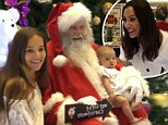 Sam Wood's baby daughter Willow sits with Santa Claus