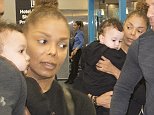 Janet Jackson cradles her 11-month-old son Eissa in Miami