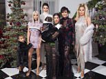 Kourtney Kardashian holds daughter Penelope for family pic