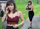 Roxanne Pallett  flashes her toned abs in tiny bralet