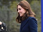 Kate shows off her blossoming bump in no-nonsense navy