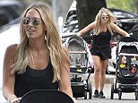 Phoebe Burgess walks to the park with daughter Poppy
