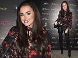Amber Davies puts on a brave face at make-up launch