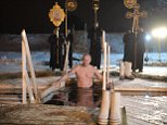 Vladimir Putin bathes in icy waters in Lake Seliger