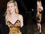 Nicola Peltz wows in gold dress at Versace MFW show