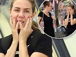 Kate Ritchie appears upset as she cups her face with hands