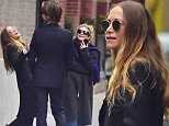 Mary-Kate and Ashley Olsen share a laugh as they chat with a pal