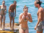 Jessica Marais enjoys a day out at the beach with rumoured boyfriend