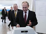 Putin casts his vote in 'rigged' Russia presidential election