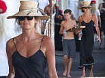 Elle Macpherson goes braless as she grabs pizza with son Cy