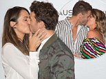 Laura Bryne and Matty J and Georgia Love and Lee Elliott  kiss on media wall at Melbourne Grand Prix
