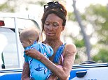 Turia Pitt dotes on newborn son Hakavai while out visiting family with fiancé Michael
