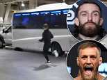 Conor McGregor is ARRESTED after attacking rival's bus in violent rampage caught on camera