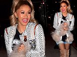 Cardi B folds her arms over her stomach in NYC after addressing pregnancy rumors
