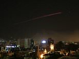 Syrian air defenses 'shoot down 13 missiles' fired in a US-led attack on the country