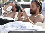 Scott Disick suns shirtless at the beach while ex Kourtney Kardashian enjoys her birthday weekend