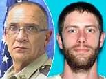 Manhunt for suspect who shot dead Maine sheriff's deputy then stole his car for robbery
