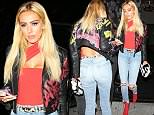 Petra Ecclestone looks sensational in revealing red top and figure-hugging jeans at Catch