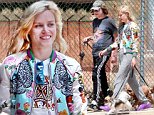 Georgia May Jagger is casual chic in embroidered jacket and grey sweatpants as she walks her dog