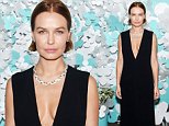 Lara Bingle flashes her generous cleavage in a VERY plunging gown