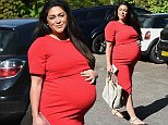 Casey Batchelor flaunts her baby bump in red bodycon dress