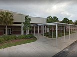 Math teacher escorted from school after unzipping a female student's jacket and fanning her stomach