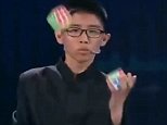 Chinese boy solves three puzzles cubes in five minutes