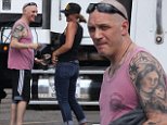 Tom Hardy sports pink tank top on set of Al Capone movie as he chats with giggling mystery blonde