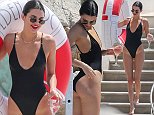 Kendall Jenner soaks up sunshine in a racy black swimsuit in Cannes