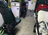 Paramedics are hit by shards of glass after 'mindless' vandal smashes ambulance window