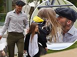 Harper Beckham looks adorable in a penguin costume as she shares a sweet kiss with David
