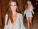 Danielle Lloyd turns heads in a perilously plunging cut-out playsuit for night out in Manchester