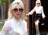 Lady Gaga channels Sixties chic in mini-skirt and boots as she signs autographs for fans at studio