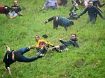 Cheese rolling champion takes home his 21st Double Gloucester after 'Britain's barmiest race' 