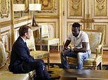 Paris migrant hero who saved dangling child meets…