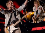 Keith Urban, 50, rocks the stage in double denim at the CMA Festival in Nashville