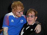 Ed Sheeran sits on Sir Elton John's lap at his AIDS Foundation ball