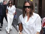 Victoria Beckham looks chic in ivory blouse and flowing skirt in Paris