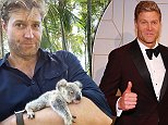 Dr Chris Brown cradles a sick koala as he films new TV series
