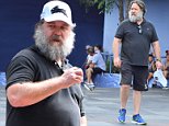 Russell Crowe sports a bushy beard during a visit to Disneyland